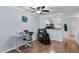 Living room with fan, hardwood floors, computer desk, massage chair, and view to the kitchen at 1120 Hidden Cove Dr # I, Mount Pleasant, SC 29464