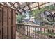 View from covered patio overlooking community pool surrounded by mature trees at 1120 Hidden Cove Dr # I, Mount Pleasant, SC 29464