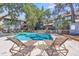 A community pool with lounge chairs for relaxing and enjoying the outdoor space at 1120 Hidden Cove Dr # I, Mount Pleasant, SC 29464