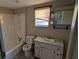 Compact bathroom with a tub-shower combo, toilet, and vanity with a sink, ready for renovation at 116 Stillfield Dr, Moncks Corner, SC 29461