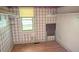 Cozy bedroom featuring patterned wallpaper, a window with natural light, and built in shelving at 116 Stillfield Dr, Moncks Corner, SC 29461