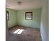 Bedroom with light green walls, stained carpet, and natural light from the window at 116 Stillfield Dr, Moncks Corner, SC 29461