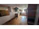 Open kitchen area with vintage cabinetry, hard wood floors, and a view into another room at 116 Stillfield Dr, Moncks Corner, SC 29461