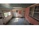 Room with multiple windows, a door, and colorful wallpaper providing natural light at 116 Stillfield Dr, Moncks Corner, SC 29461