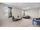 Versatile bonus room with soft carpet, futon, bean bag, and natural light offers flexible living space at 118 Lagoona Dr, Summerville, SC 29483