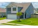 Charming two-story home with a well-manicured lawn and attached two-car garage at 118 Lagoona Dr, Summerville, SC 29483