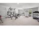 Spacious home gym with carpet flooring and natural light from the windows offers a great space for fitness at 118 Lagoona Dr, Summerville, SC 29483