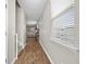 Well-lit hallway with hardwood floors leading to a living area with comfortable seating at 118 Lagoona Dr, Summerville, SC 29483