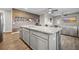 Bright kitchen features a large island, granite countertops, stainless steel appliances, and an open view to the living room at 118 Lagoona Dr, Summerville, SC 29483