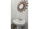 Stylish powder room featuring a pedestal sink with a decorative mirror above at 118 Lagoona Dr, Summerville, SC 29483