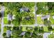A scenic aerial view of a neighborhood's tree-lined streets and cozy houses at 1203 Forestwood Dr, Charleston, SC 29407