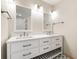 Bathroom with double vanity, modern fixtures, white cabinets and marble countertop at 1203 Forestwood Dr, Charleston, SC 29407
