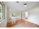 Bright bedroom with wood floors, neutral walls, large windows, and ensuite bathroom at 1203 Forestwood Dr, Charleston, SC 29407