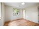 Bright and airy bedroom with hardwood floors, a large window, and soft neutral walls, offering a comfortable retreat at 1203 Forestwood Dr, Charleston, SC 29407