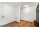 Laundry room with wood floors, white walls, and access to other parts of the home at 1203 Forestwood Dr, Charleston, SC 29407