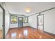 Living room with hardwood floors, neutral trim and walls, and a view of the front yard at 1203 Forestwood Dr, Charleston, SC 29407