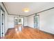 Spacious living room featuring hardwood floors, white walls, and neutral trim at 1203 Forestwood Dr, Charleston, SC 29407