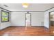 Bright living room showcasing hardwood floors and neutral wall paint with a view into the updated kitchen at 1203 Forestwood Dr, Charleston, SC 29407