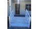 Close-up of the freshly painted front entrance with new stairs and updated railing at 1229 Winston St, Charleston, SC 29407