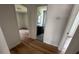 Hallway view, including a bathroom with a dark vanity and light walls at 1229 Winston St, Charleston, SC 29407