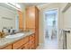 Well-lit bathroom featuring a granite countertop, wood cabinets and drawers for storage, and access to the toilet at 133 Axtell Dr, Summerville, SC 29485