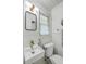 Charming bathroom showcases a modern sink, updated fixtures, and a window for natural light at 133 Axtell Dr, Summerville, SC 29485