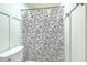 Clean and functional bathroom featuring a toilet and shower area with a decorative shower curtain at 133 Axtell Dr, Summerville, SC 29485
