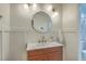 Stylish bathroom featuring a modern sink and vanity with a round mirror and designer lighting at 133 Axtell Dr, Summerville, SC 29485