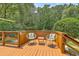 Inviting outdoor deck with comfortable seating, perfect for enjoying the surrounding nature at 133 Axtell Dr, Summerville, SC 29485