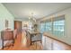 Bright dining room featuring hardwood floors, large windows, and modern furnishings at 133 Axtell Dr, Summerville, SC 29485