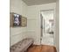Inviting hallway featuring a tufted bench seat and access to the nearby bedroom at 133 Axtell Dr, Summerville, SC 29485