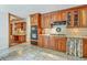 Traditional kitchen features wooden cabinets, tile floors, updated appliances and ample counter space at 133 Axtell Dr, Summerville, SC 29485