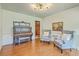 Cozy living room with classic piano, hardwood floors, and comfortable seating at 133 Axtell Dr, Summerville, SC 29485