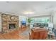 Spacious living area features brick fireplace, hardwood floors, and comfortable furniture at 133 Axtell Dr, Summerville, SC 29485
