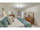 Cozy bedroom with a queen-sized bed, neutral tones, classic furniture, and plush, teal throw blanket at 133 Axtell Dr, Summerville, SC 29485