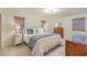 Comfortable bedroom featuring a well-dressed bed, three windows, and classic wood furniture at 133 Axtell Dr, Summerville, SC 29485