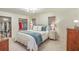 Light-filled bedroom with a queen-sized bed, side tables, and an organized walk-in closet at 133 Axtell Dr, Summerville, SC 29485