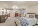 Spacious bedroom featuring a queen-size bed, sliding barn door to the bathroom, and two windows at 133 Axtell Dr, Summerville, SC 29485