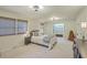 Airy bedroom featuring a queen-size bed, two windows, and walk-in closet for maximum storage at 133 Axtell Dr, Summerville, SC 29485