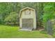 Backyard shed with a charming design, blending seamlessly with the natural surroundings at 133 Axtell Dr, Summerville, SC 29485