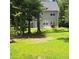 Spacious backyard with mature trees providing shade and privacy at 133 Pelican Lane, Summerville, SC 29485