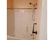 Clean white bathtub and shower combination with chrome fixtures and a sturdy grab bar at 133 Pelican Lane, Summerville, SC 29485