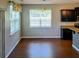 Bright dining area with hardwood floors, dark cabinetry, and natural light at 133 Pelican Lane, Summerville, SC 29485