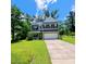 Charming two-story home with a well-manicured lawn, gray siding, and inviting curb appeal at 133 Pelican Lane, Summerville, SC 29485
