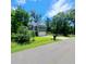 Well-maintained two-story home with attached garage, green lawn, and mature trees at 133 Pelican Lane, Summerville, SC 29485