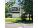 Charming two-story home boasts manicured lawn, attached garage and lovely curb appeal at 133 Pelican Lane, Summerville, SC 29485