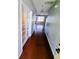 Hallway with wood floors and white french doors at 133 Pelican Lane, Summerville, SC 29485