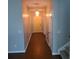 Long hallway with wood flooring and natural light at 133 Pelican Lane, Summerville, SC 29485