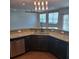 Well-appointed kitchen features stainless steel dishwasher and a breakfast bar at 133 Pelican Lane, Summerville, SC 29485