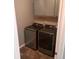 Laundry room with a front-load washer and dryer, as well as storage cabinets at 133 Pelican Lane, Summerville, SC 29485